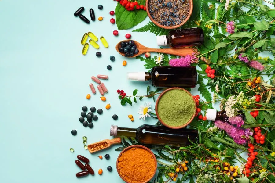 Botanical ingredients next to several different supplement formats.
